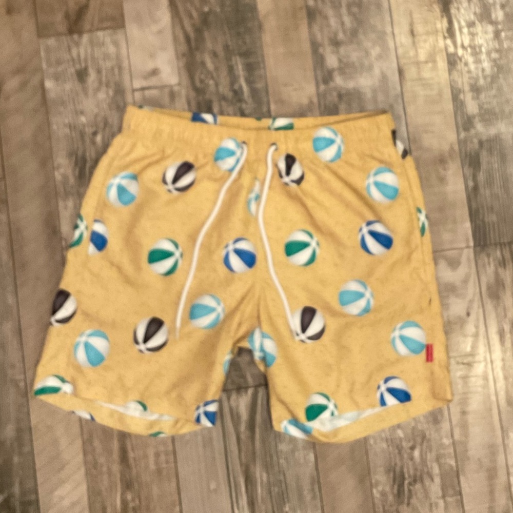 Small men’s beach ball baiting suit never worn